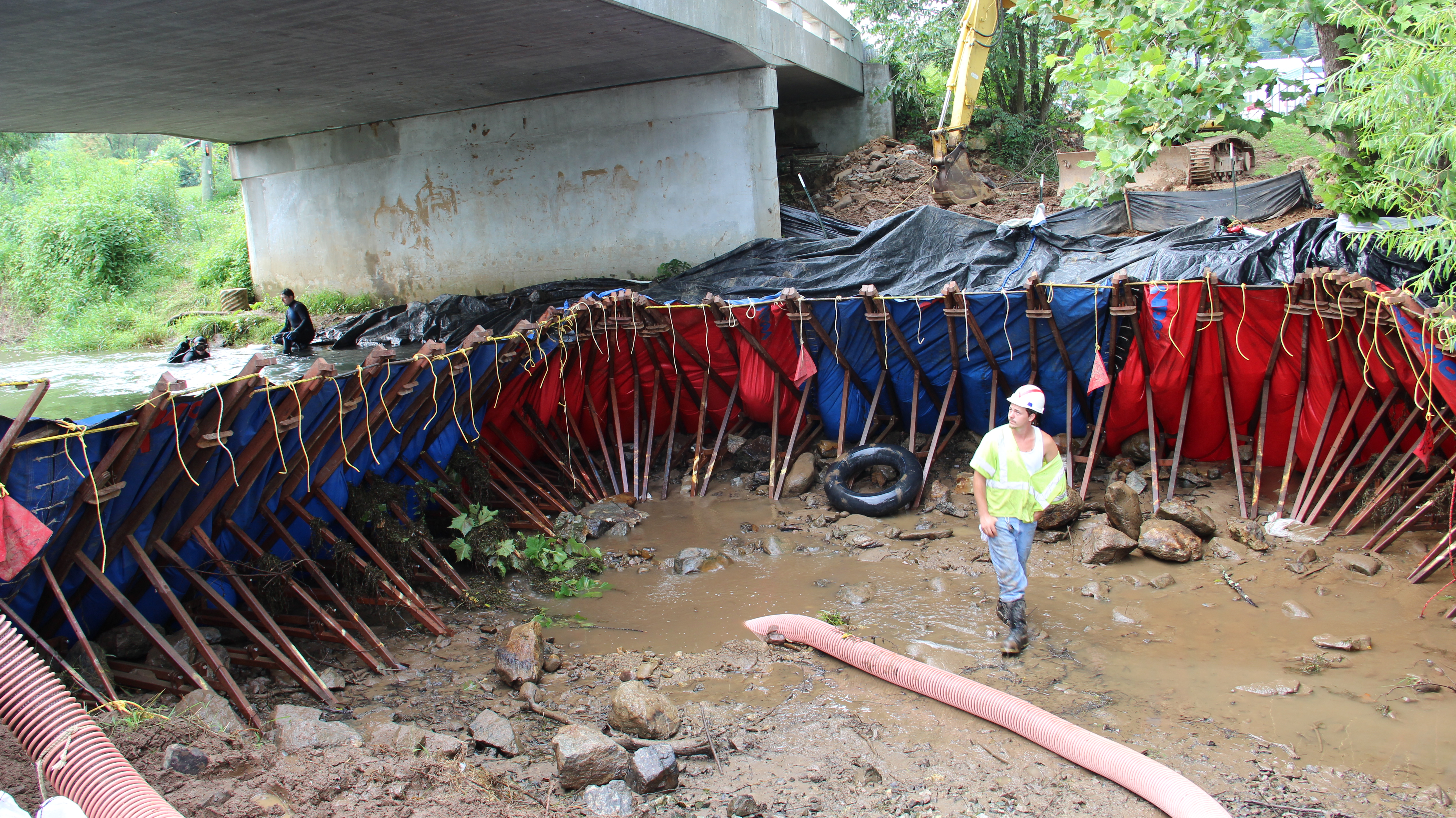 Construction Crews Dam Cripple Creek to Lay Underground Water Pipe